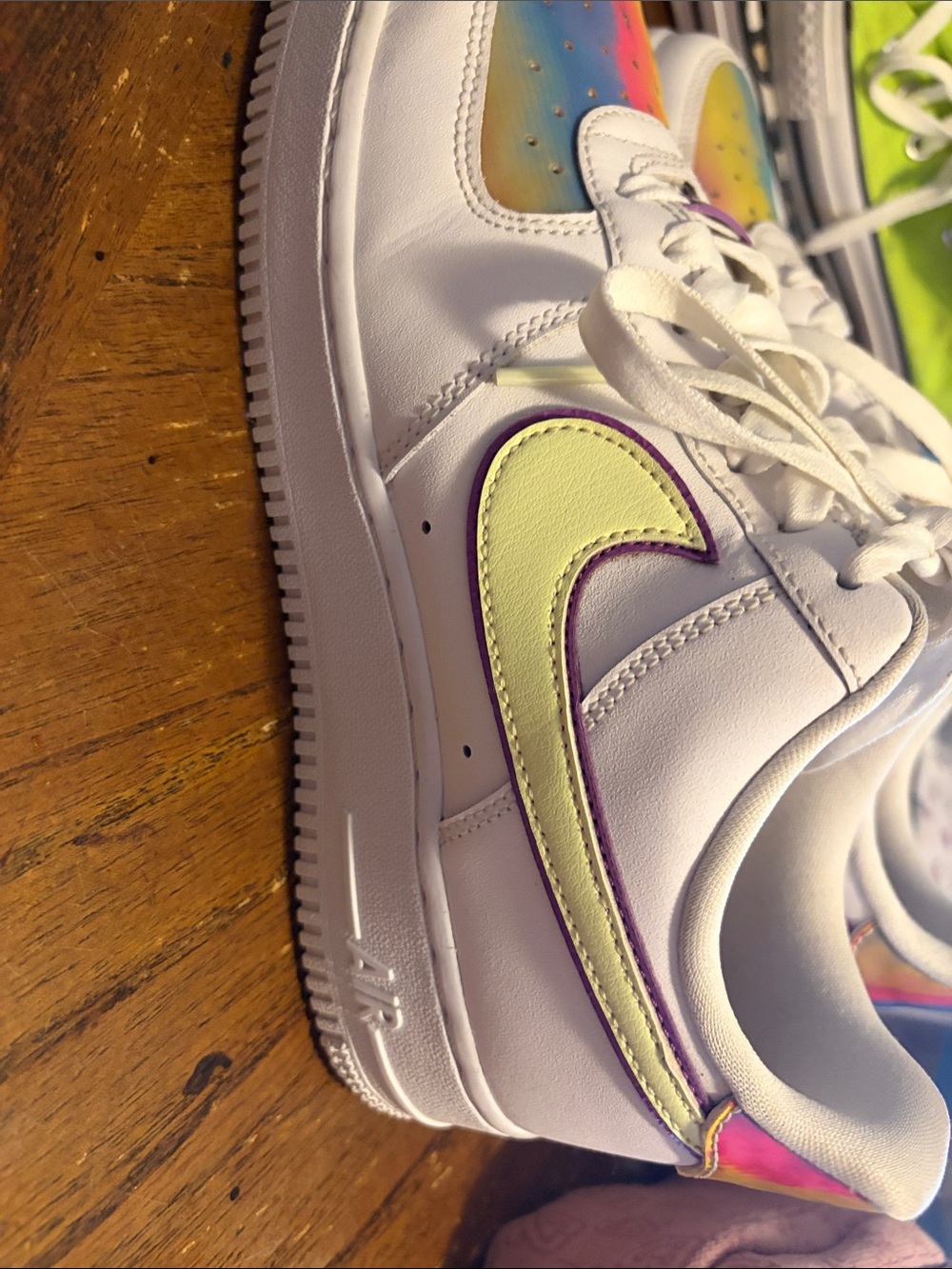 Nike White Low-Top Sneakers with Yellow and Purple Swoosh